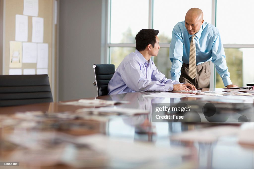 Businessmen in Conference Room