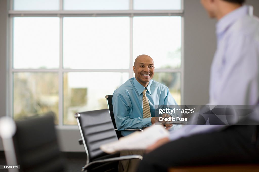 Businessmen in Conference Room