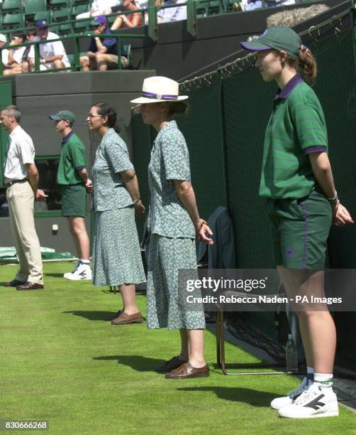 Careful concentration from line judges and ball boys and girls during the First Round match of the Lawn Tennis Championships at Wimbledon, London,...