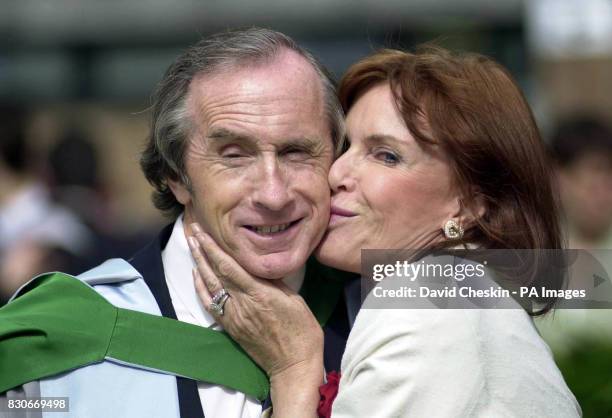 Former racing driver Sir Jackie Stewart gets a kiss from his wife Helen, after he was confered at Stirling University in Stirling, Scotland, an...