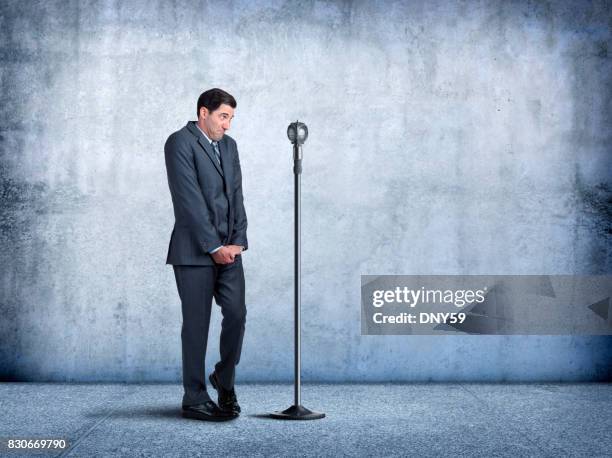 businessman with fear of public speaking - tímido imagens e fotografias de stock
