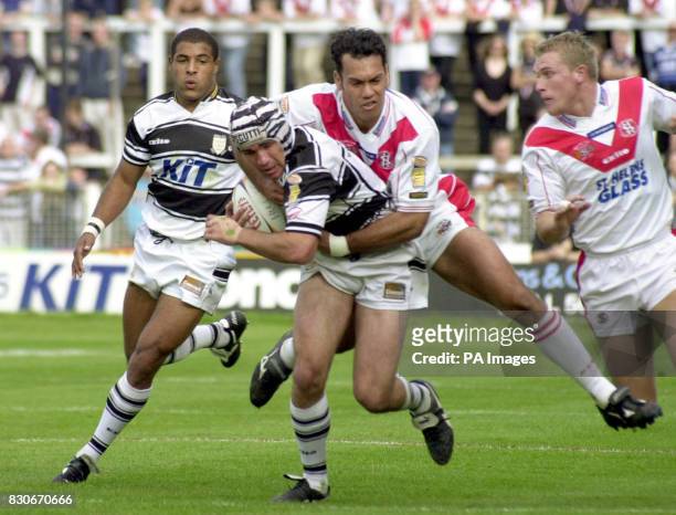 Hull FC's Deon Bird is tackled by St Helens' Kevin Iro, during the Tetley's Bitter Super League game at The Boulevard Ground, Hull.