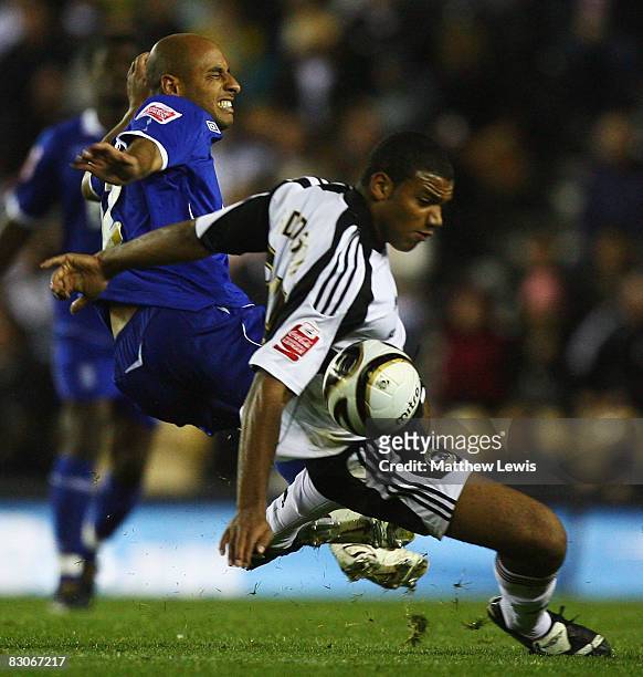 Miles Addison of Derby and Medhi Nafti of Birmingham challneg for the ball during the Coca-Cola Championship match between Derby County and...