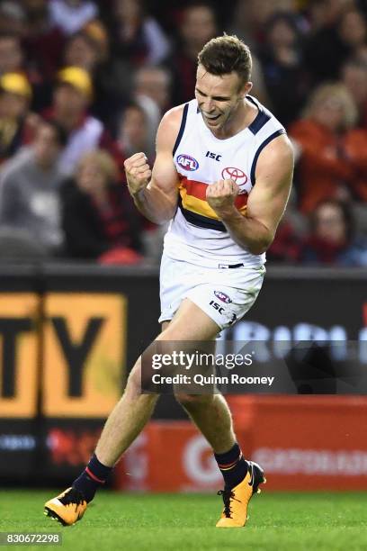 Brodie Smith of the Crows celebrates kicking a goal during the round 21 AFL match between the Essendon Bombers and the Adelaide Crows at Etihad...