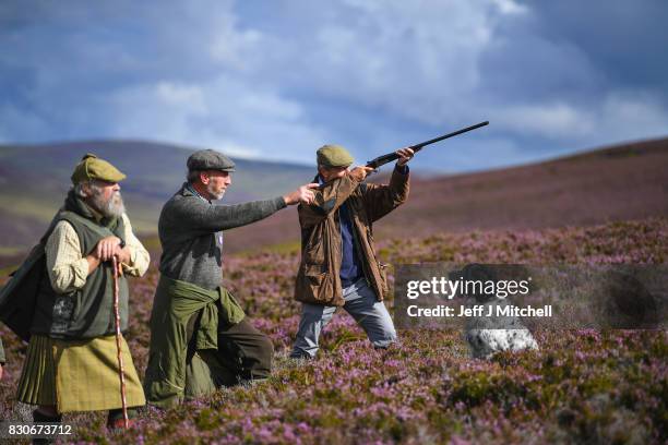 Head keeper Graeme MacDonald leads a shooting party at the beginning of a new shooting season on a grouse moor at the Alvie Estate on August 12, 2017...