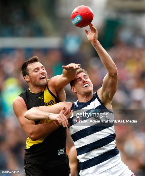 Toby Nankervis of the Tigers and Zac Smith of the Cats compete in a ruck contest during the 2017 AFL round 21 match between the Geelong Cats and the...