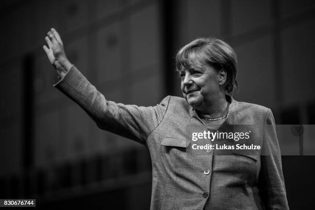 German Chancellor and head of the German Christian Democrats Angela Merkel arrives at the CDU federal election campaign opening rally on August 12,...