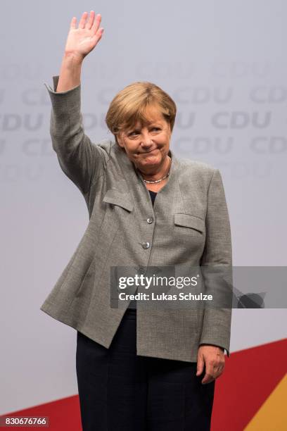 German Chancellor and head of the German Christian Democrats Angela Merkel waves his hand at the CDU federal election campaign opening rally on...