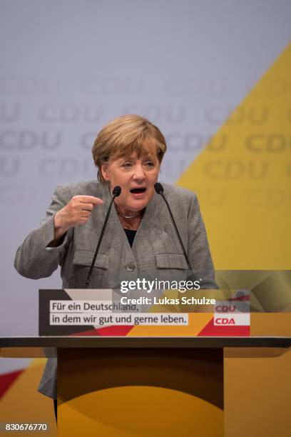 German Chancellor and head of the German Christian Democrats Angela Merkel speaks at the CDU federal election campaign opening rally on August 12,...