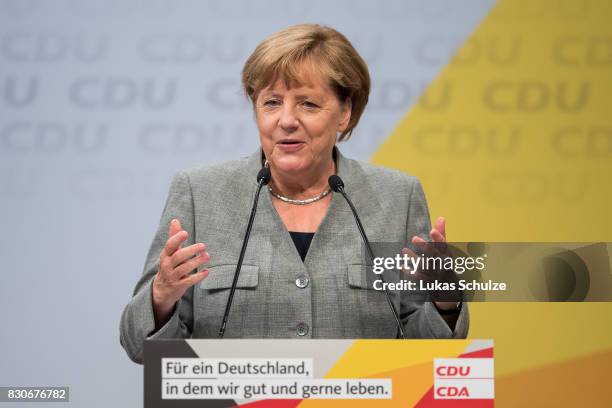 German Chancellor and head of the German Christian Democrats Angela Merkel speaks at the CDU federal election campaign opening rally on August 12,...
