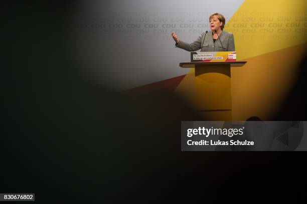 German Chancellor and head of the German Christian Democrats Angela Merkel speaks at the CDU federal election campaign opening rally on August 12,...