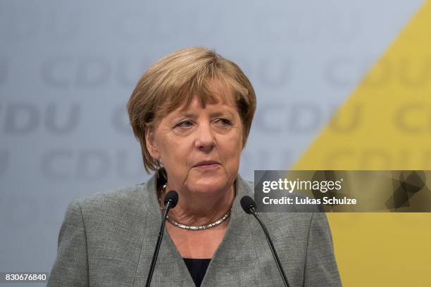 German Chancellor and head of the German Christian Democrats Angela Merkel speaks at the CDU federal election campaign opening rally on August 12,...