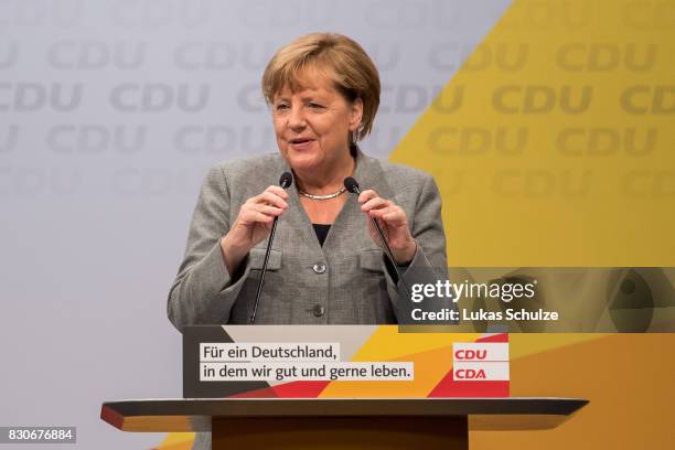 German Chancellor and head of the German Christian Democrats Angela Merkel speaks at the CDU federal election campaign opening rally on August 12,...