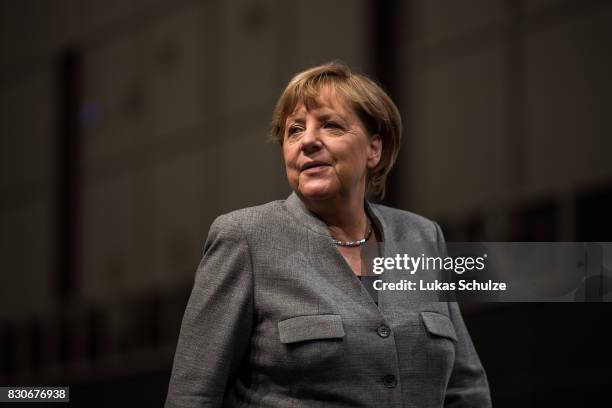 German Chancellor and head of the German Christian Democrats Angela Merkel arrives at the CDU federal election campaign opening rally on August 12,...