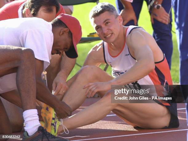 Jonathan Edwards receiving treatment after seeing his attempt at a Triple Jump World Record end on the run up as he collapsed while making his final...