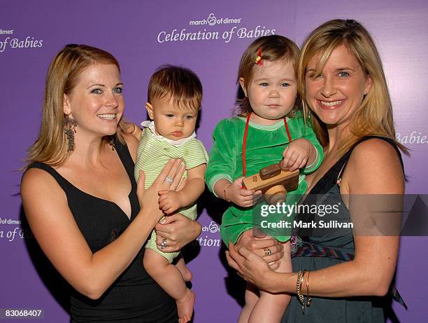 Melissa Joan Hart and son Brayden with Kellie Martin and daughter Maggie arrive at the "Celebration of Babies" silent auction and luncheon to benefit...