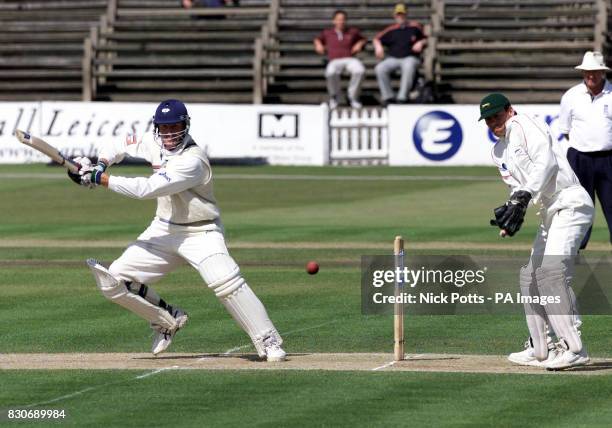 Yorkshire's David Byas square cuts away from Leicestershire's wicketkeeper Neil Burns, off Phil DeFreitas' bowling during the CricInfo Championship...