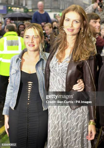 Actresses Kate Winslet and Saffron Burrows arrive for the premiere of the film "Enigma" at the Odeon cinema in Edinburgh.