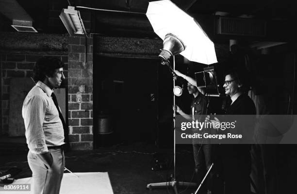 Fashion, celebrity and art photographer, Richard Avedon, poses activist Tom Hayden during a 1976 New York, New York, photo session for Rolling Stone...