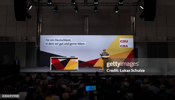 German Chancellor and head of the German Christian Democrats Angela Merkel speaks at the CDU federal election campaign opening rally on August 12,...