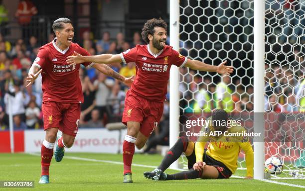 Liverpool's Egyptian midfielder Mohamed Salah celebrates scoring his team's third goal during the English Premier League football match between...