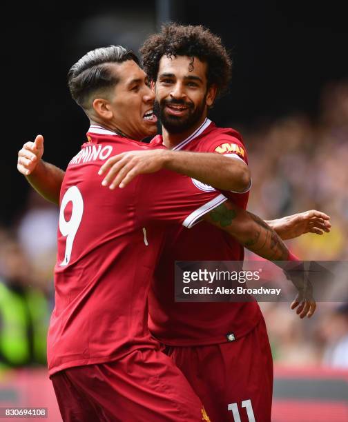 Mohamed Salah of Liverpool celebrates scoring his sides third goal with Roberto Firmino of Liverpool during the Premier League match between Watford...