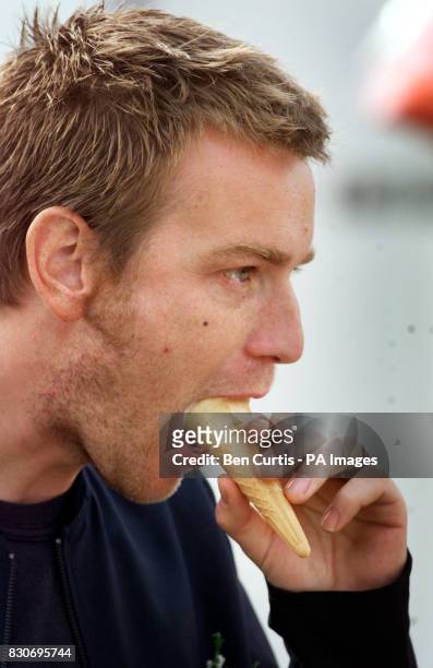 Actor Ewan McGregor licks an ice-cream at the 160th Lonach Highland Gathering at Strathdon near Balmoral in Scotland. Stars Robin Williams and Billy...