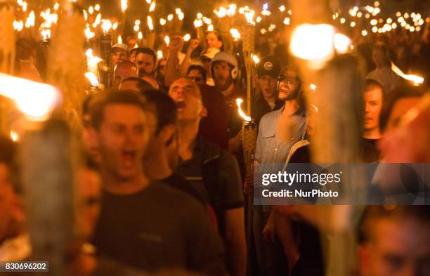 Neo Nazis, Alt-Right, and White Supremacists take part a the night before the 'Unite the Right' rally in Charlottesville, VA, white supremacists...