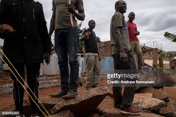 Opposition supporters gather as they clashed against Kenyan police forces in the Kibera slum on August 12, 2017 in Nairobi, Kenya. Demonstrations...