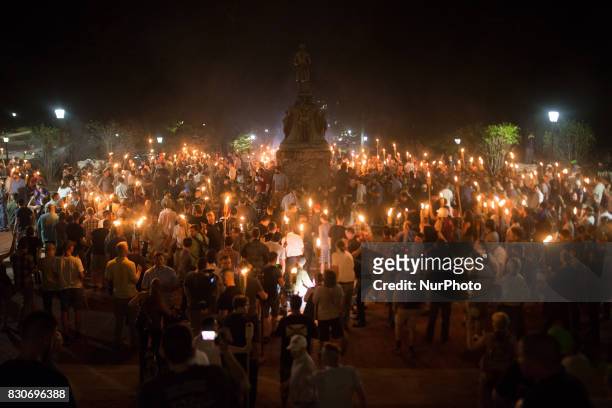 Neo Nazis, Alt-Right, and White Supremacists encircle counter protestors at the base of a statue of Thomas Jefferson after marching through the...