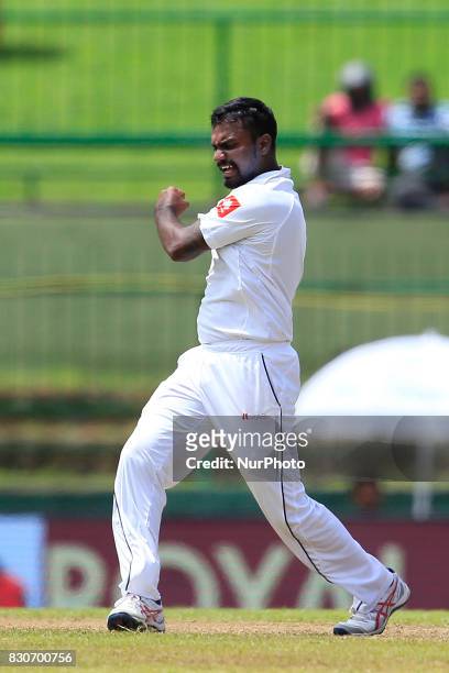 Sri Lankan cricketer Malinda Pushpakumara celebrates after taking a wicket during the 1st Day's play in the 3rd Test match between Sri Lanka and...