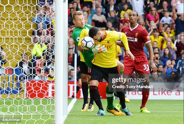 Miguel Britos of Watford scores his sides third goal past Simon Mignolet of Liverpool during the Premier League match between Watford and Liverpool...