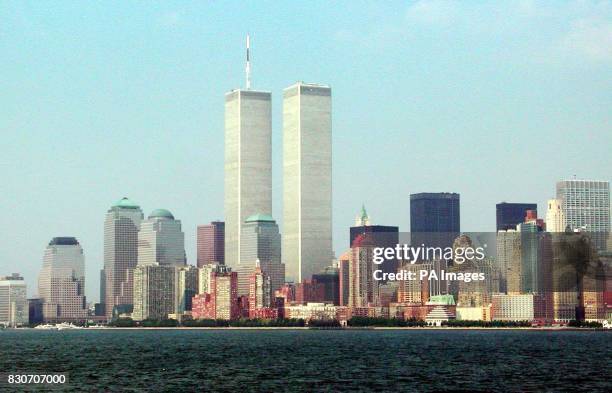 Taken from Ellis Island of Manhattan's skyline showing the twin towers of the World Trade Center which have both collapsed following a terrorist...