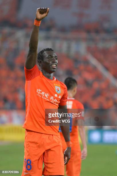 Papiss Demba Cisse of Shandong Luneng celebrates a point during the 22nd round match of 2017 Chinese Football Association Super League between...