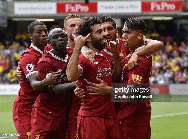 Mohamed Salah of Liverpool celebrates after scoring during the Premier League match between Watford and Liverpool at Vicarage Road on August 12, 2017...