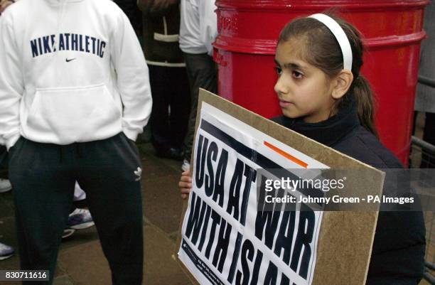 Girl holding an al-Muhajiroun placard joins protestors outside the Pakistan High Commission offices in central London, demonstrating against...
