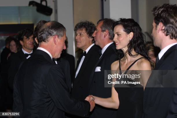 Prince Charles meets actress Saffron Burrows at the Royal premiere of the film Enigma in London's Leicester Square. Actress Kate Winslet pulled out...