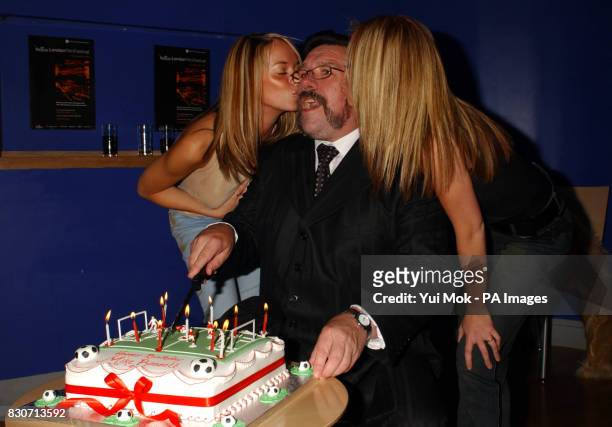 Ricky Tomlinson receives birthday kisses from Liz McClarnon and Natasha Hamilton of Atomic Kitten as he cuts his birthday cake at the world premiere...