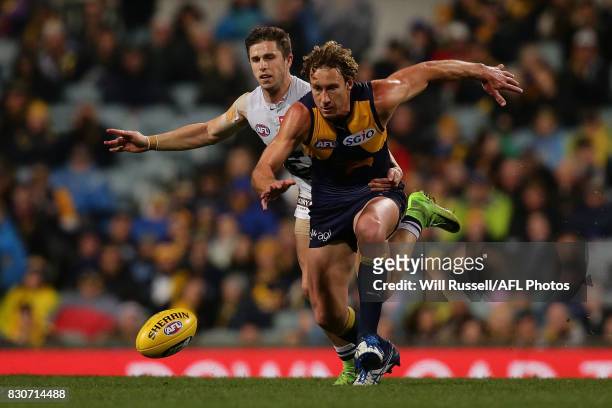 Matt Priddis of the Eagles and Marc Murphy of the Blues chase the ball during the round 21 AFL match between the West Coast Eagles and the Carlton...
