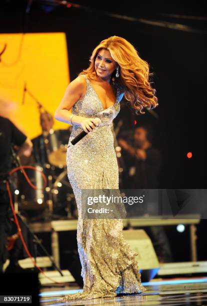 Lebanese singer Nawal al-Zoghbi performs in the Gulf emirate of Dubai late September 30, 2008 as part of celebrations of the Eid Al-Fitr holiday. The...