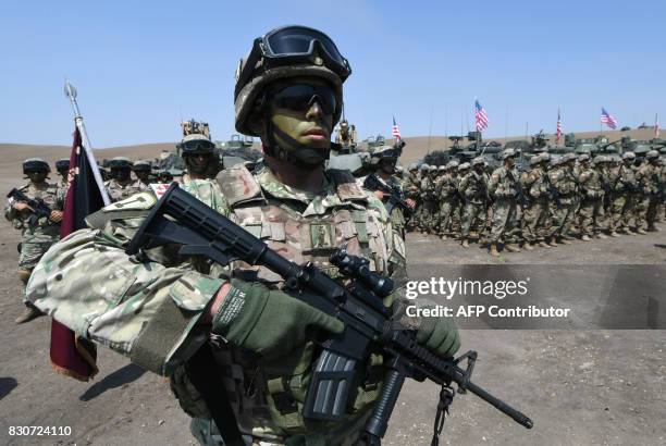 Georgian and US soldiers line up during the official closing ceremony of the multinational military exercise 'Noble Partner 2017' at the military...