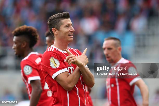 Robert Lewandowski of Muenchen celebrates after scoring his team's third goal during the DFB Cup first round match between Chemnitzer FC and FC...