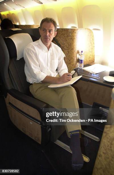 British Prime Minister Tony Blair, on flight to Cairo on the latest leg of his Middle East diplomatic mission after the heaviest wave yet of air...
