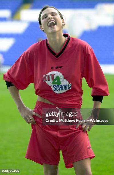 Model Kate Groombridge reacts to the size of her shorts during the launch of Kit4Schools at Tottenham's White Hart Lane ground in London. * ......