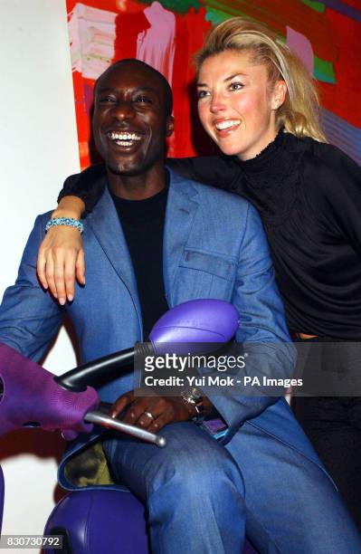 Fashion designer Ozwald Boateng with socialite Tamara Beckwith at an auction of specially commissioned Vespa scooters, in aid of Action on Addiction,...