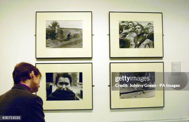 Culture Secretary Tessa Jowell looks at photographs taken by Robert Capa and his girlfriend Gerda Taro during the Spanish Civil War, inside the...