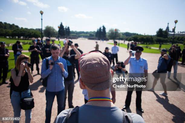 Activists participate in the St Petersburg LGBT Pride march on august 12, 2017