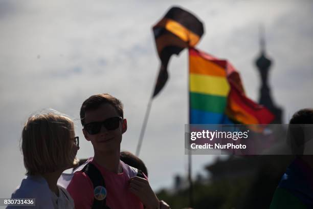 Activists participate in the St Petersburg LGBT Pride march on august 12, 2017