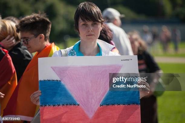 Activists participate in the St Petersburg LGBT Pride march on august 12, 2017