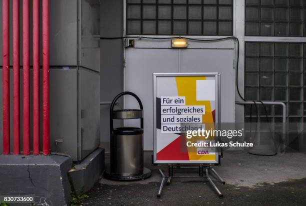 Placard of the German Christian Democrats is seen in front of an exit after the CDU federal election campaign opening rally on August 12, 2017 in...
